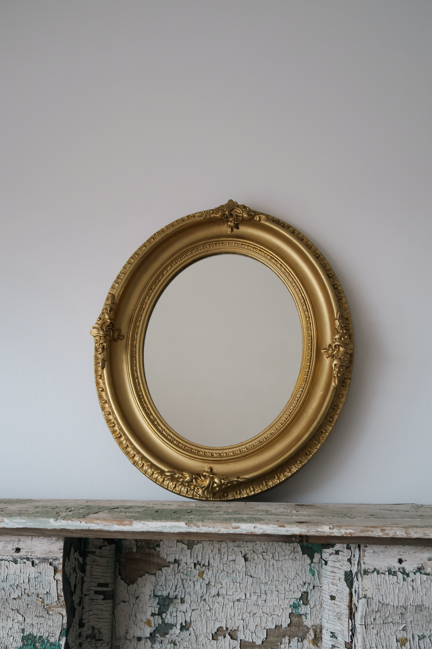 Vintage Oval-Framed Gilt Coat Mirror